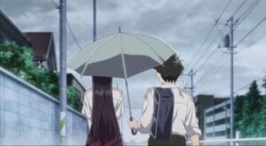 The boy and girl walking under the Same Umbrella